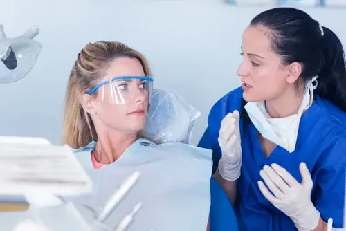dentist explaining to patient