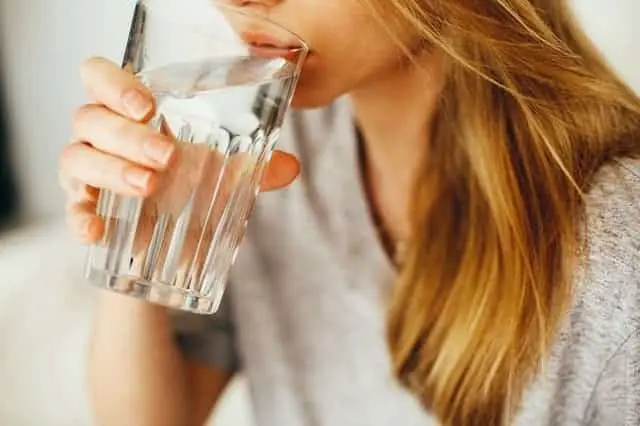 drinking a glass of water